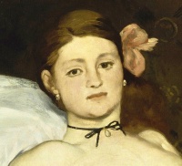 Olympia (detail) by Édouard Manet, painted in 1863, depicting a courtesan gazing at her viewer.